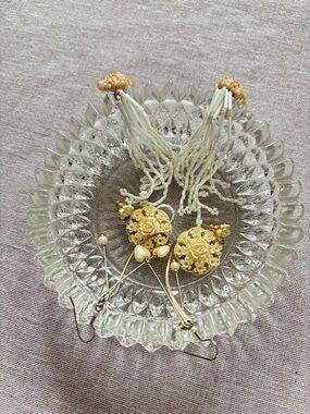 Set of three vintage cream earrings.